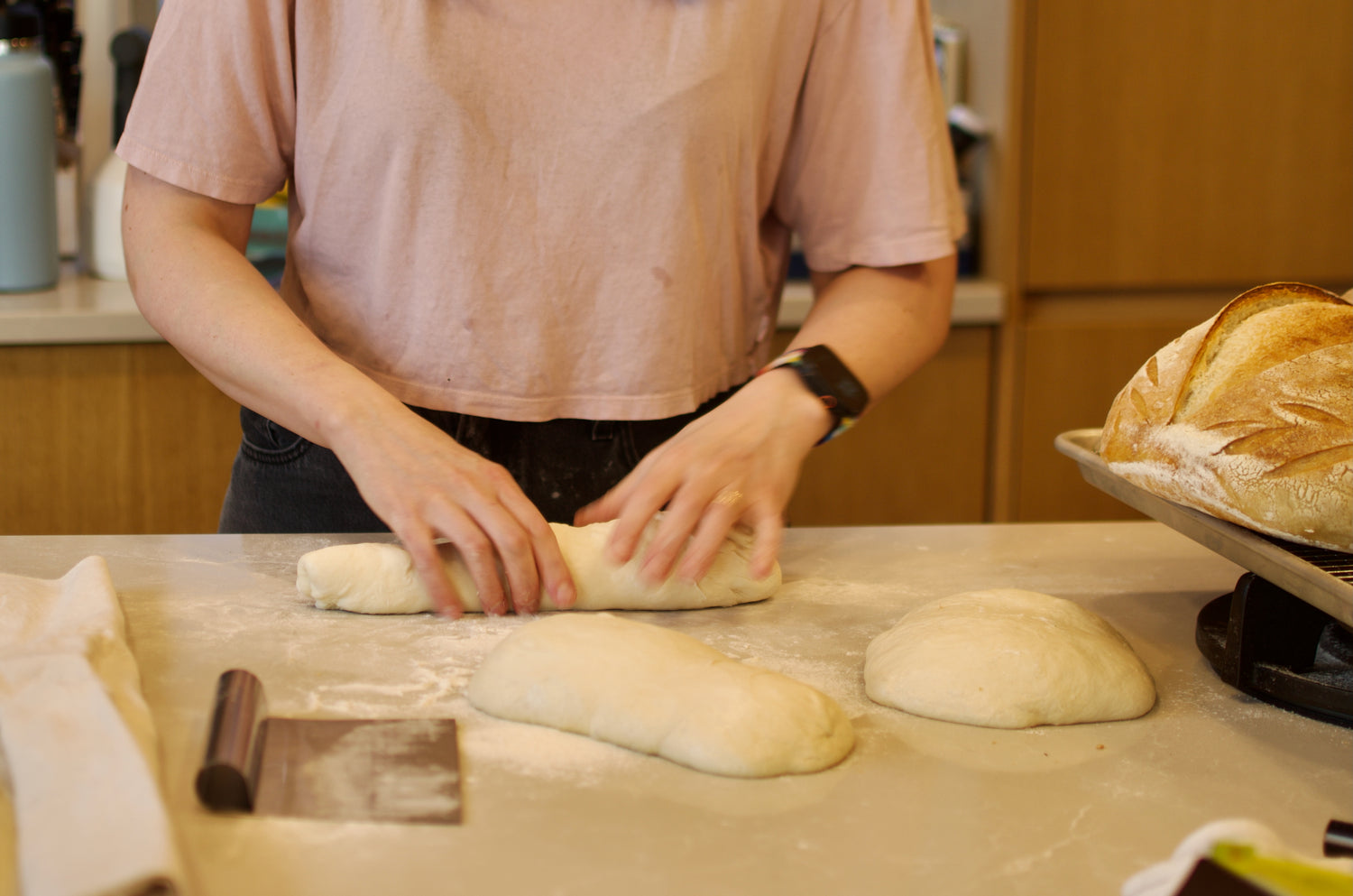 Eleonore shaping Crescent Bakes dough in her home kitchen. 